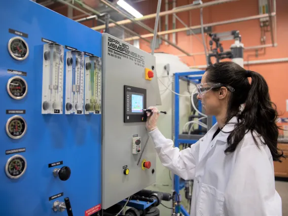 Lab scientist working with a reverse osmosis system at WEST Center