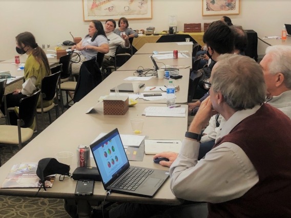Researchers meeting in a conference room