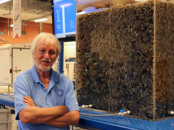 Dr. Ian Pepper standing in front of WEST Center lab equipment