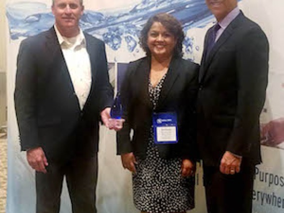 Attendees at the WateReuse event in Austin, TX holding an award for Transformational Innovation given at the event.