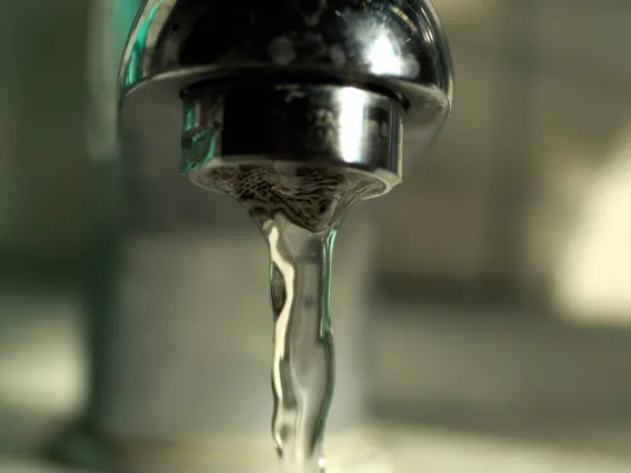 Water faucet with water coming out