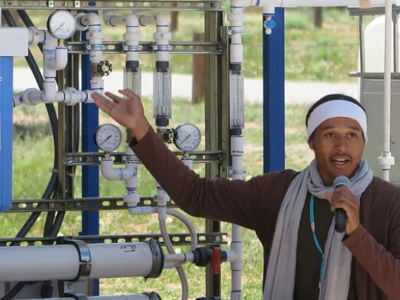 Indige-FEWSS Intern giving a presentation about water filtration