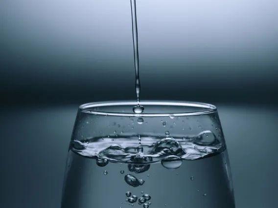 Glass with pouring water