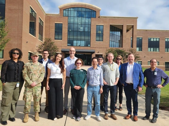 Group of people in front of a research building in Mississippi