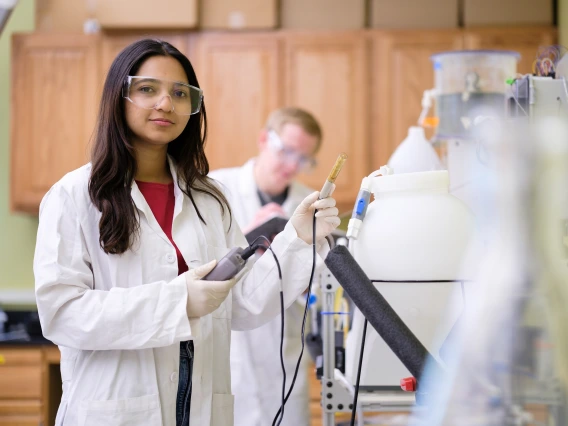 Laboratory workers with experimental instruments