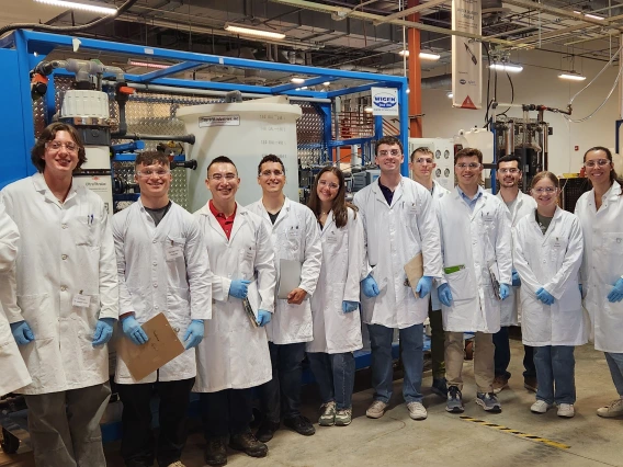 A group of people in lab coats