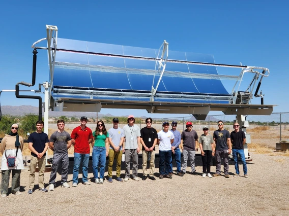 AWP Field School group in front of a large solar panel 