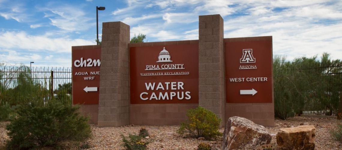 Photo of Pima County Water Campus with a sign that points to the WEST Center