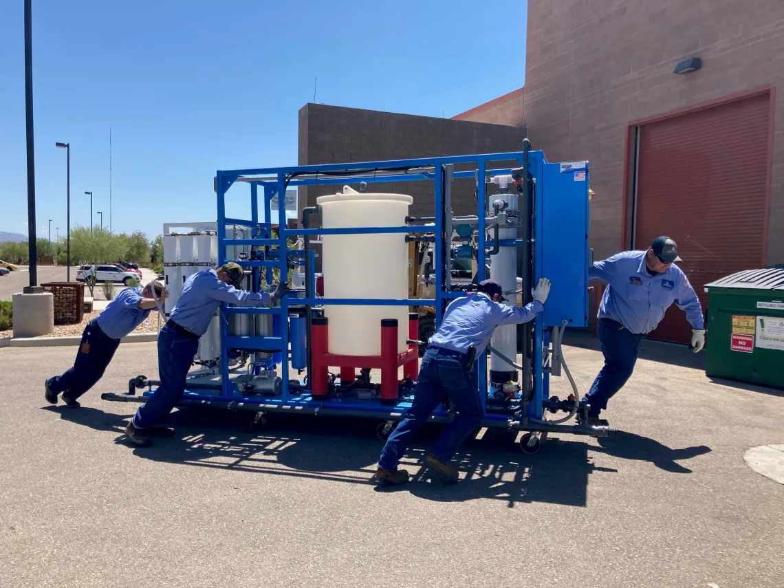 Technicians working to move new technology into the WEST center