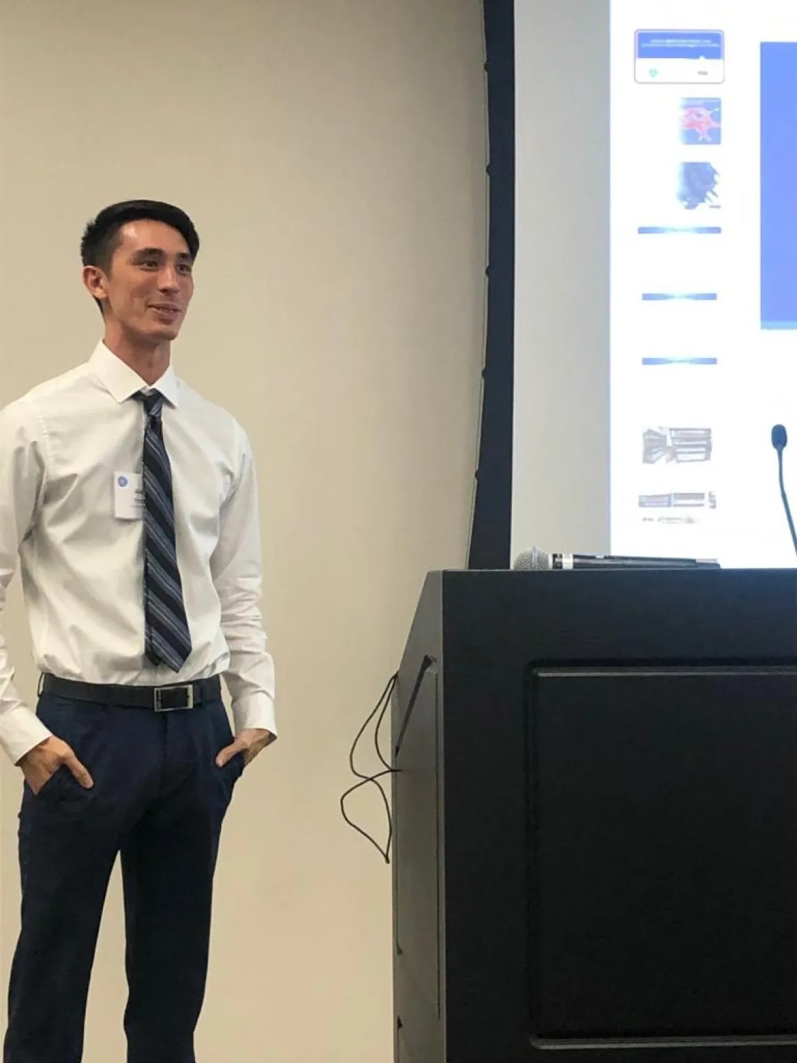 Person giving a presentation in a conference room