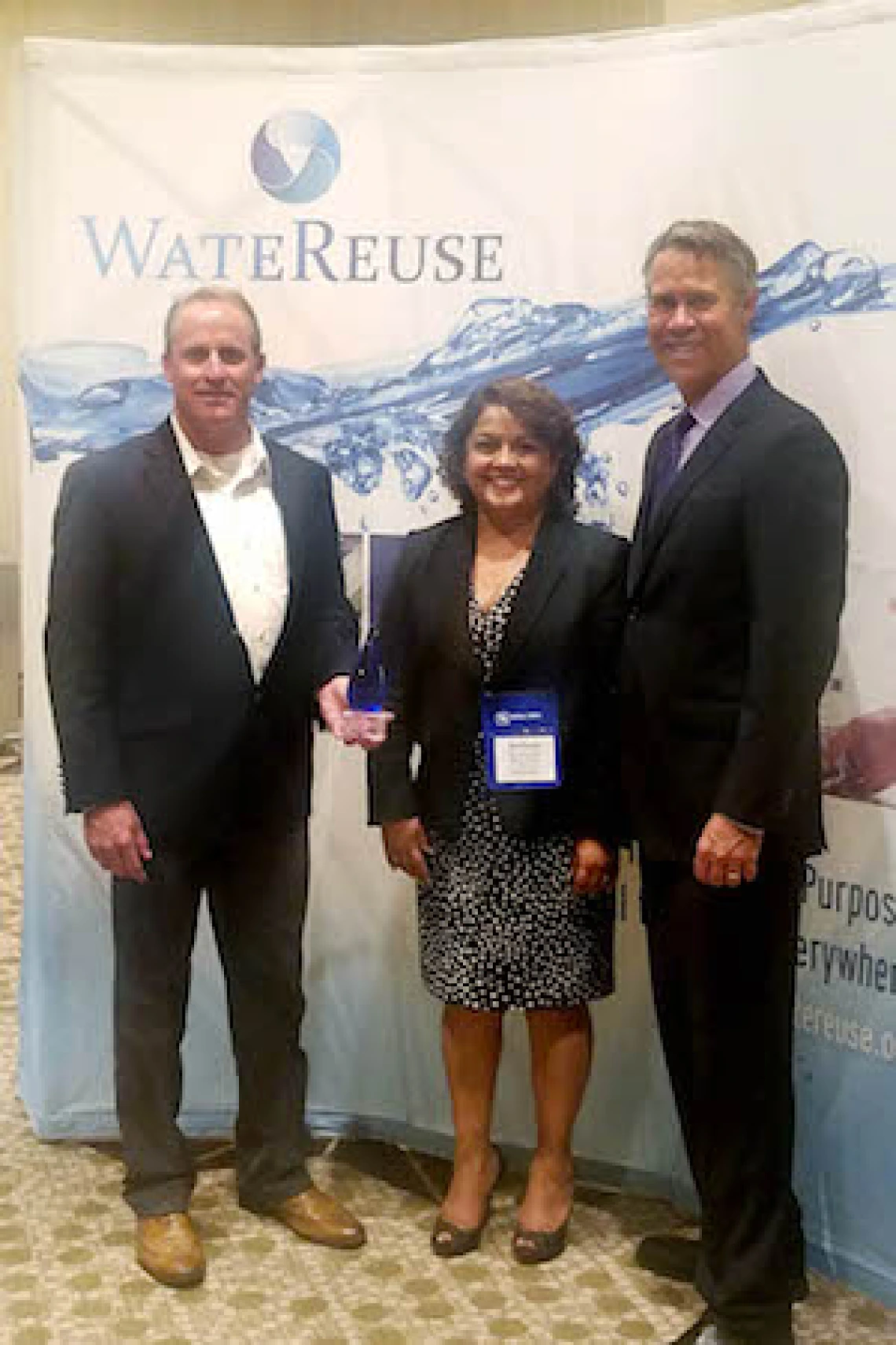 Attendees at the WateReuse event in Austin, TX holding an award for Transformational Innovation given at the event.