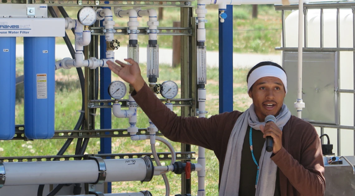 Indige-FEWSS Intern giving a presentation about water filtration