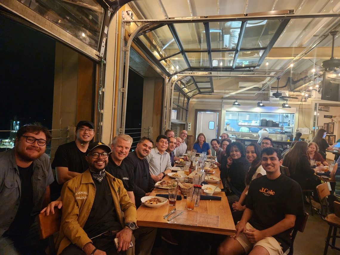 A group of people having dinner in a restaurant