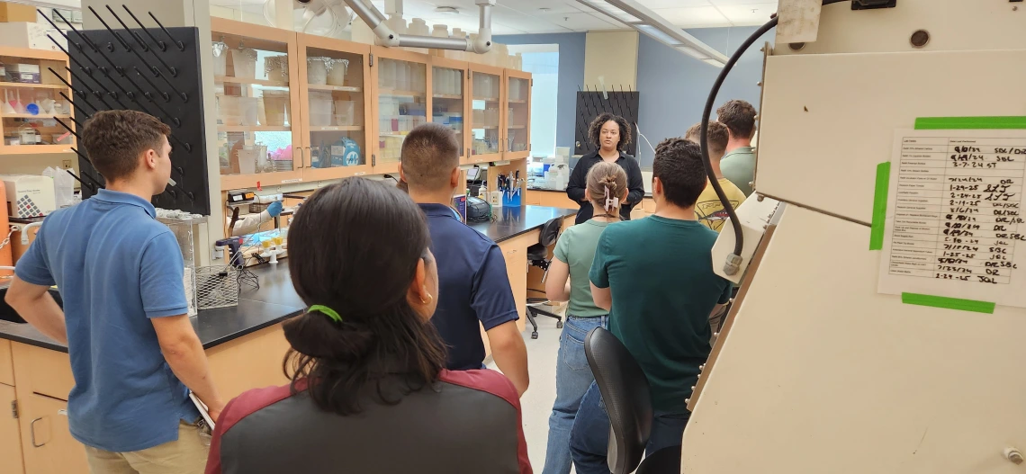 Group of people on tour in microbiology laboratory