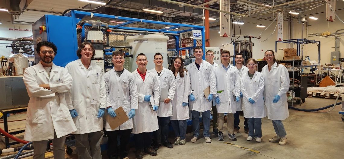 A group of people in lab coats