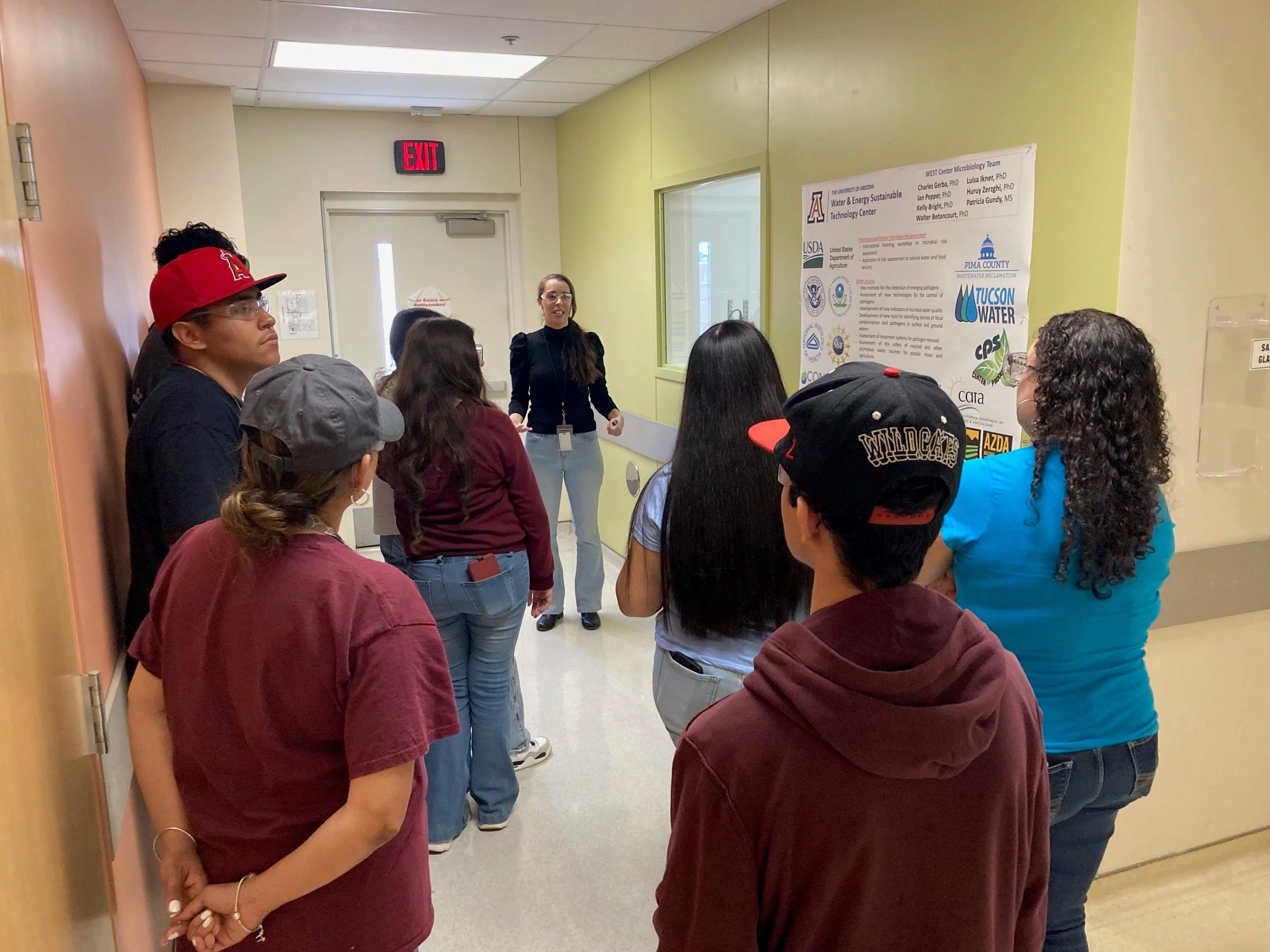 Students and presenter in a hallway