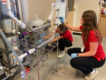 Students working at a UV Reactor