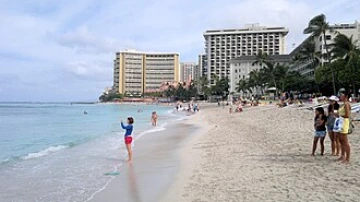 Waikiki beach with people and buildings