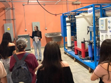 People and a water purification system in a laboratory