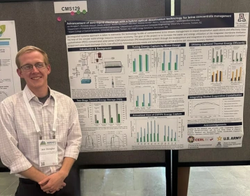 Researcher Jeb Shingler with poster at AEESP Conference