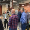 A group of people in a high bay laboratory