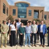 Group of people in front of a research building in Mississippi