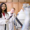 Laboratory workers with experimental instruments